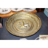 A large antique Indian brass bowl