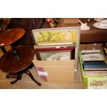 A box of various large pictures and prints