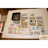 A quantity of various old bank notes and coinage