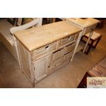 A washed wood effect multi drawer side cabinet