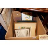 A box of various pictures and prints