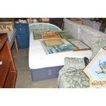 A double divan bed and mattress with wicker headbo