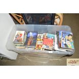 A box of various books to include anime and manga