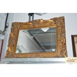 A large gilt framed bevel edged wall mirror AF