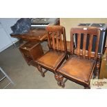 An oak extending dining table together with a set