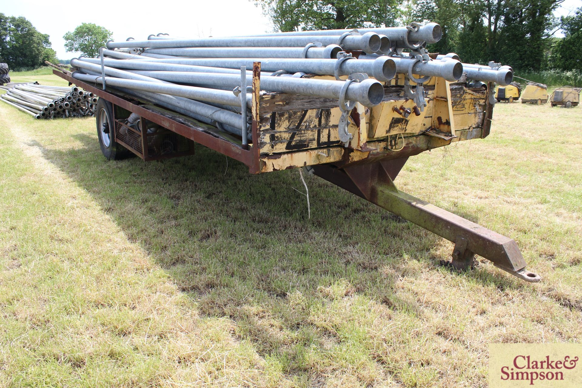 c. 7m single axle flat bed trailer. With super single wheels and tyres. Axle/ brakes stuck. Pipes - Image 2 of 11