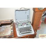 An Olympia typewriter in fitted case
