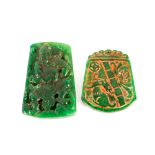 Two jade type pendants with carved decoration