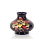 A Moorcroft "Columbine" pattern vase of compressed