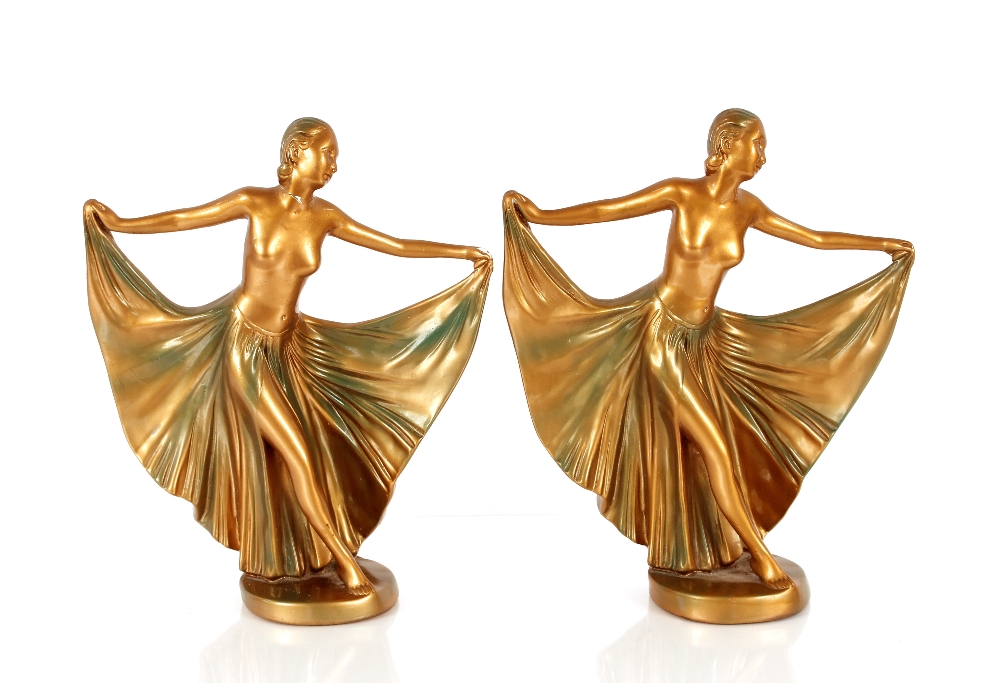 A pair of gilded plaster figures of semi-naked dan