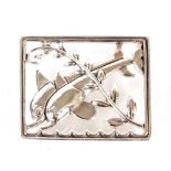 A white metal dolphin brooch