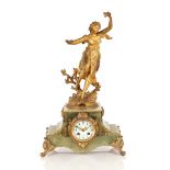 A French gilded spelter and green marble mantel cl