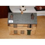 A wooden house shaped tea caddy, 26.5cm wide x 20c