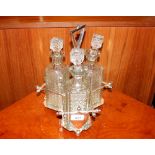 A silver plated dresser style three bottle Tantalu