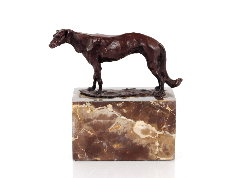 A bronze study of a hound, raised on marble plinth
