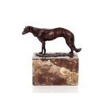 A bronze study of a hound, raised on marble plinth