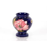 A Moorcroft "Pink Magnolia" pattern vase of balust