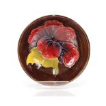 A Moorcroft "Hibiscus" pattern with brown ground a