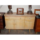 A stripped elm Ercol sideboard fitted two drawers