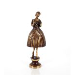 A bronze figure of a lady in crinoline dress, 25cm