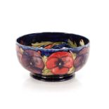 A Moorcroft "Pansy" pattern fruit bowl, the interi