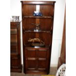 A dark Ercol corner cabinet, the upper section fit