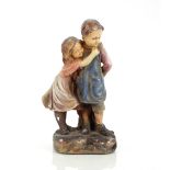 A plaster figure group depicting a boy and girl, 3