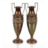 A pair of twin handled brass baluster vases, raise
