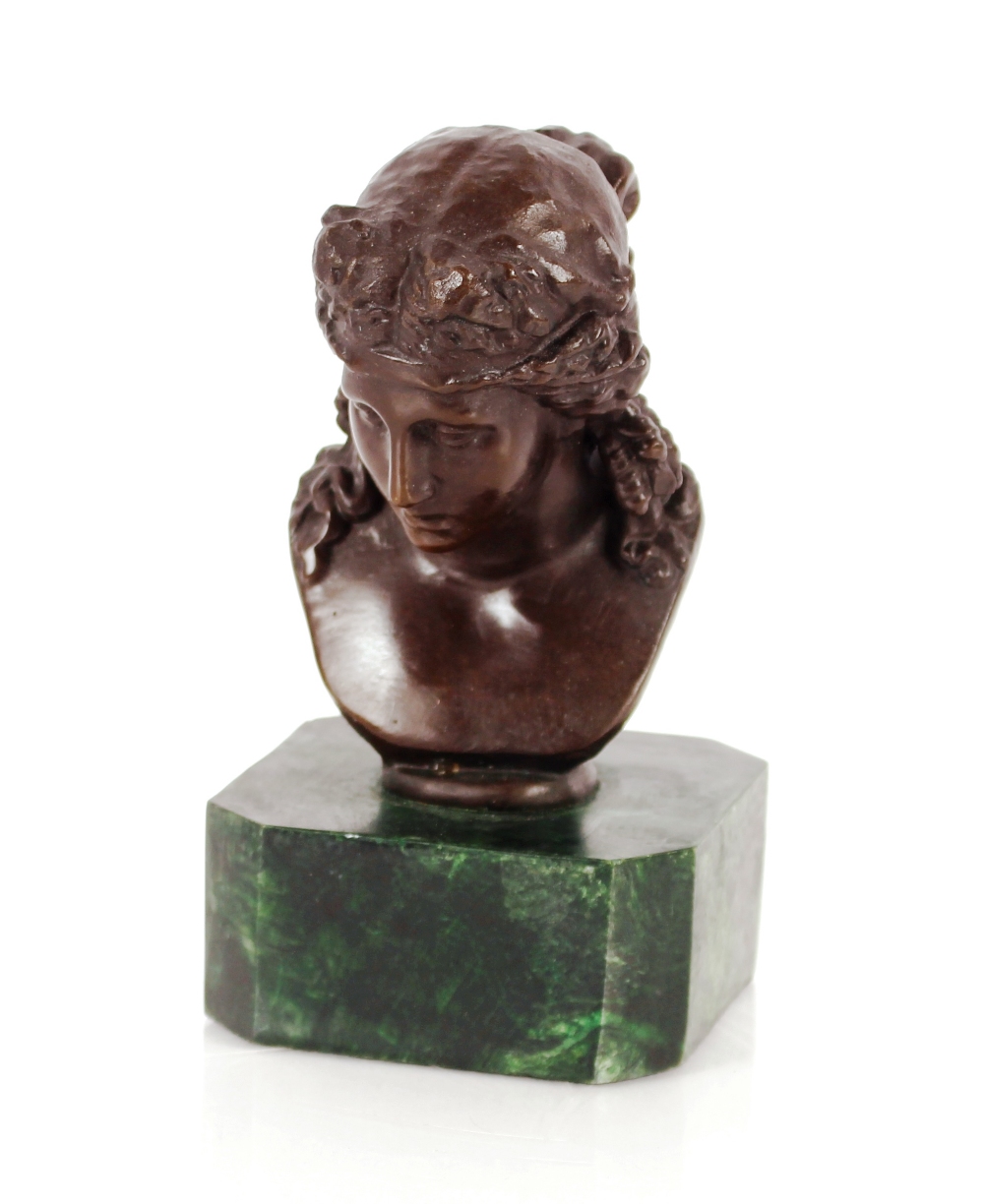 A bronze bust, in the classical style on faux Mala