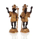 A pair of gilded spelter Blackamoor candle holders