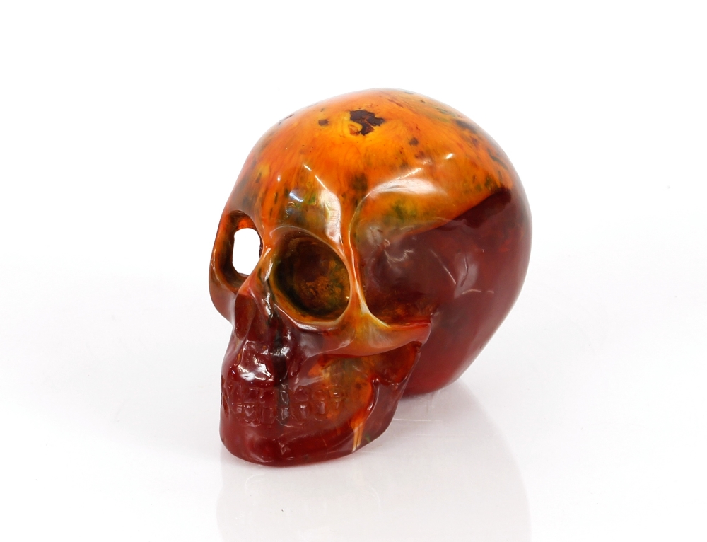 A decorative amber coloured skull