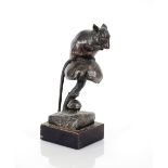 A bronze figure of a mouse seated on a toadstool,