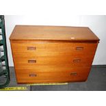 A G-plan type teak chest fitted three long drawers, 71cm high x 102cm wide x 41cm deep