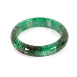 A carved jade type bangle