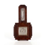 An Art Deco oak wall barometer / thermometer