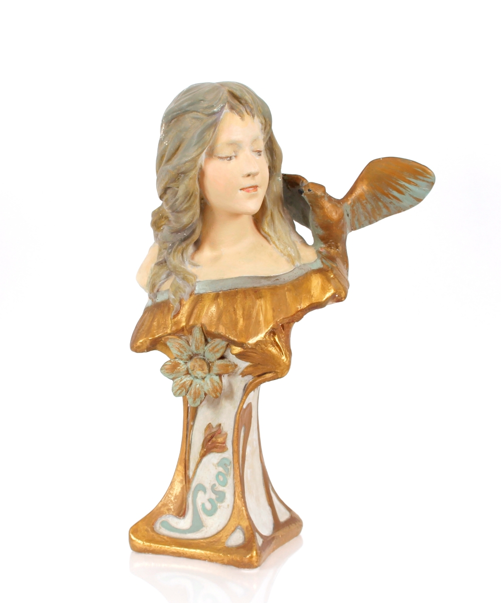 A glazed plaster bust of an Art Nouveau lady with