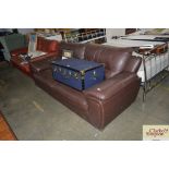 A brown leatherette upholstered three seater sette