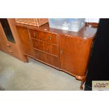 A reproduction sideboard fitted three drawers