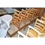A set of 6 ladder back dining chairs