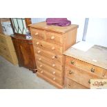 A modern stripped pine chest fitted two short over