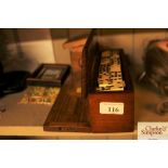 A mahogany cased box of dominoes; crib board etc