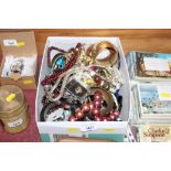 A box of various costume jewellery