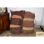 Two large Eastern rug cushions