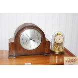 A brass and glass anniversary clock together with