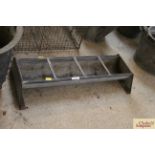 A small galvanised four section trough