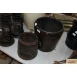 An oak bucket with a coat of arms and a small met