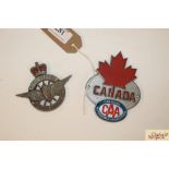 A Canada Automobile Association car badge and a Ci