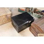 A tin deed box with the name of W & GB Ltd. Debent