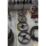 A pair of cast iron shepherd hut wheels with axles