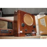 A vintage walnut cased radio